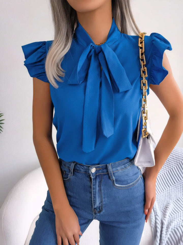 Ludowika Ruffled Tie Neck Cap Sleeve Blouse