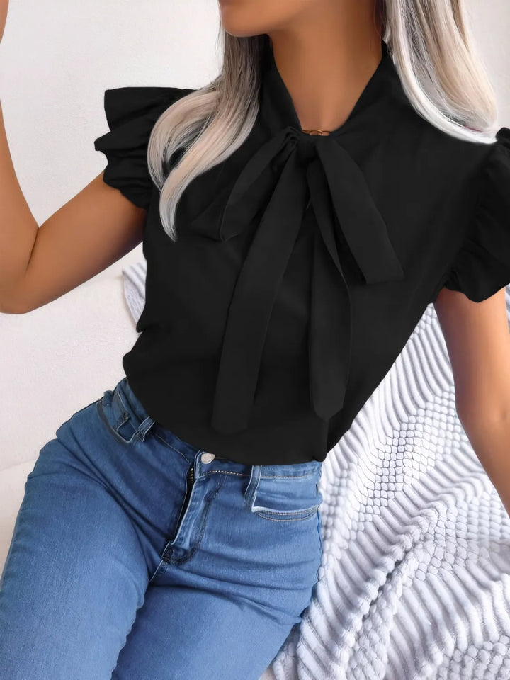 Ludowika Ruffled Tie Neck Cap Sleeve Blouse