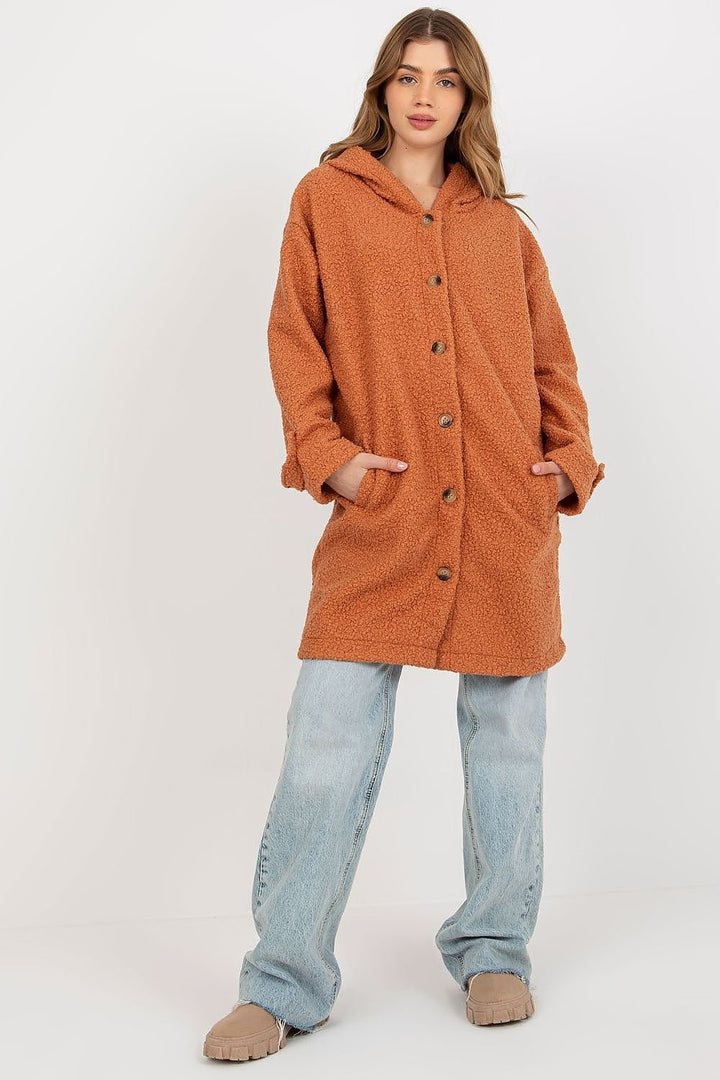 A cozy long-sleeve plush coat featuring a button closure, a hood for added warmth, and convenient slip pockets. The coat is unlined and uninsulated, offering a lightweight and comfortable fit.






