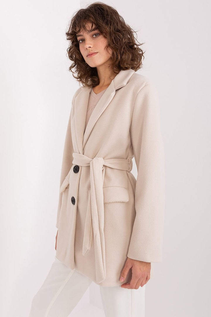 A smooth women's coat made of high-quality polyester, featuring a soft texture, long sleeves, and a classic cut. This versatile transitional coat includes a button closure, a standard length, and a lining for added comfort and durability. Perfect for both casual and formal occasions, it exudes timeless elegance and style.







