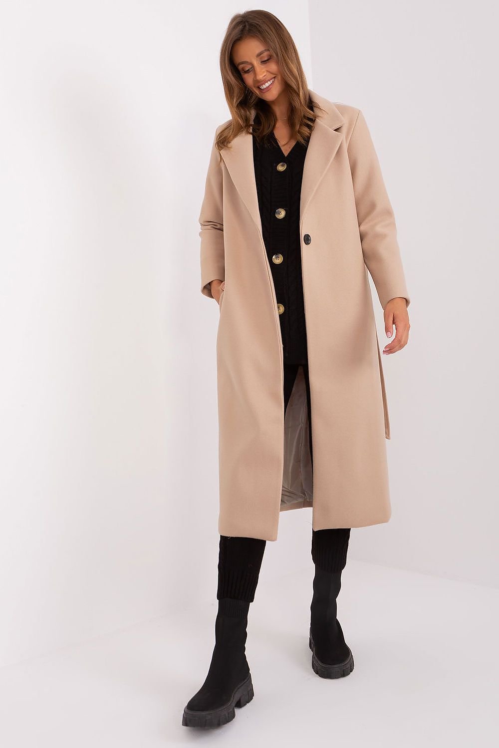 A versatile women's long transitional coat made from durable polyester, featuring a button closure, tie belt, and practical slip pockets. With a classic plain pattern, this uninsulated coat is perfect for autumn and spring, offering both style and comfort for casual, work, or formal occasions.






