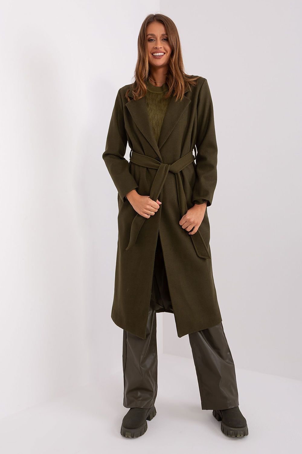 A versatile women's long transitional coat made from durable polyester, featuring a button closure, tie belt, and practical slip pockets. With a classic plain pattern, this uninsulated coat is perfect for autumn and spring, offering both style and comfort for casual, work, or formal occasions.






