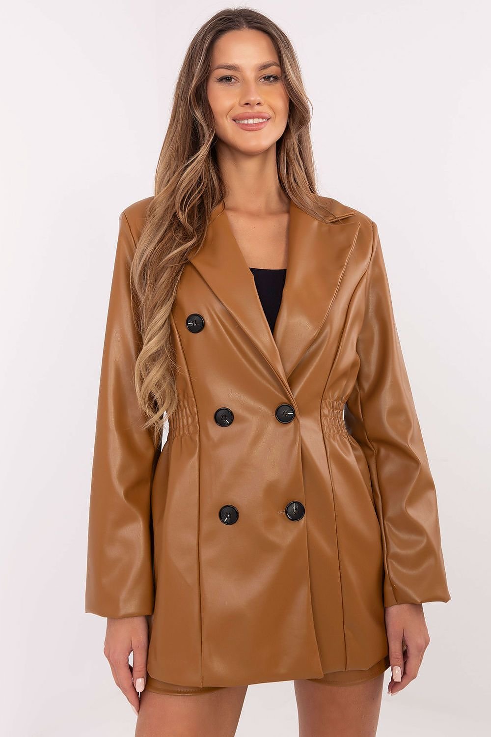 A sophisticated women's eco-leather jacket made from a durable blend of polyester and polyurethane. Featuring wide lapels, sewn-in shoulder pads, a double-breasted button fastening, and decorative waist creases, this standard-length blazer combines elegance with a feminine, structured silhouette. Lined for comfort, it is perfect for fall, winter, and spring, offering versatile styling options for both casual and formal occasions.






