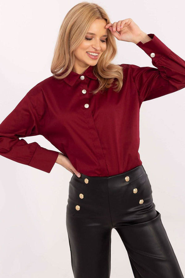 A classic women's shirt made of high-quality cotton, featuring a formal design with a classic collar, long sleeves, and three decorative buttons on the front, perfect for work or formal occasions.






