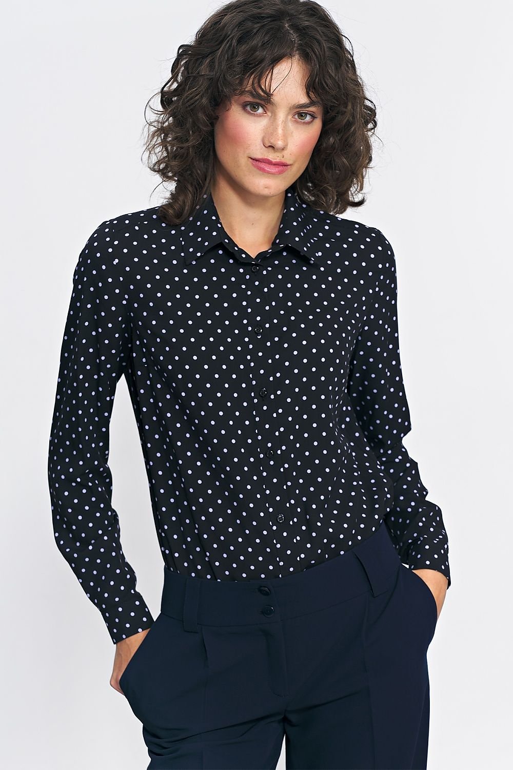 A stylish women's viscose shirt featuring a delicate collar and long sleeves, adorned with a green and pea print. Perfect for fall, this versatile shirt pairs beautifully with both classic and bold styles, whether worn solo or layered under a cardigan or blazer.






