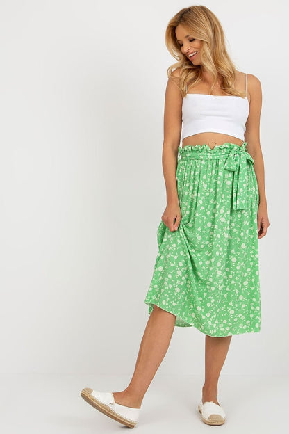 A flared skirt made of vibrant floral fabric with a waist tie for a customizable fit. Lightweight and stylish, it’s ideal for casual and dressy occasions alike.






