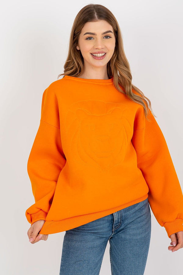 A ladies' blouse featuring long sleeves, a round neckline, and elegant decorative embroidery on the front. A versatile piece for casual or semi-formal wear.






