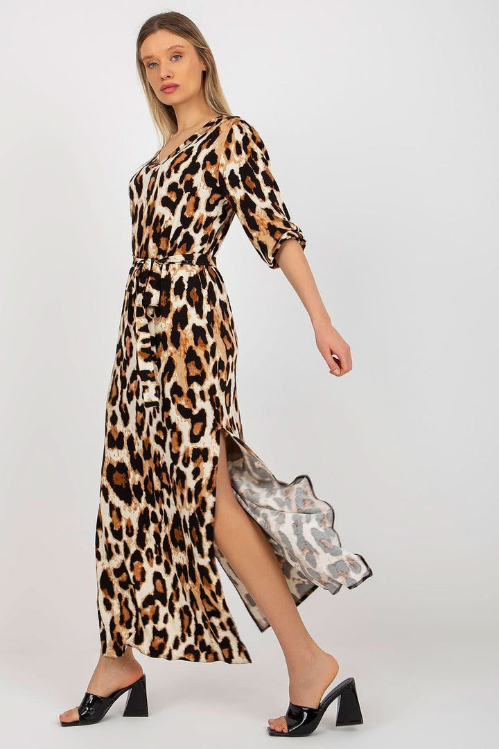 Chic long dress with 3/4 sleeves, heart neckline, free slits at the bottom, and a tie belt for a flattering fit.