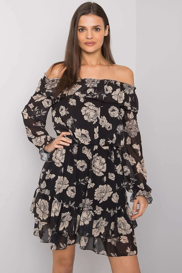 This elegant dress features long sleeves and a flattering Spanish-style neckline, adding a bold and graceful touch. The dress is fully lined for comfort, while the bottom is beautifully adorned with delicate frills, enhancing its feminine charm. A perfect blend of classic style and modern flair, ideal for both casual and more formal occasions.







