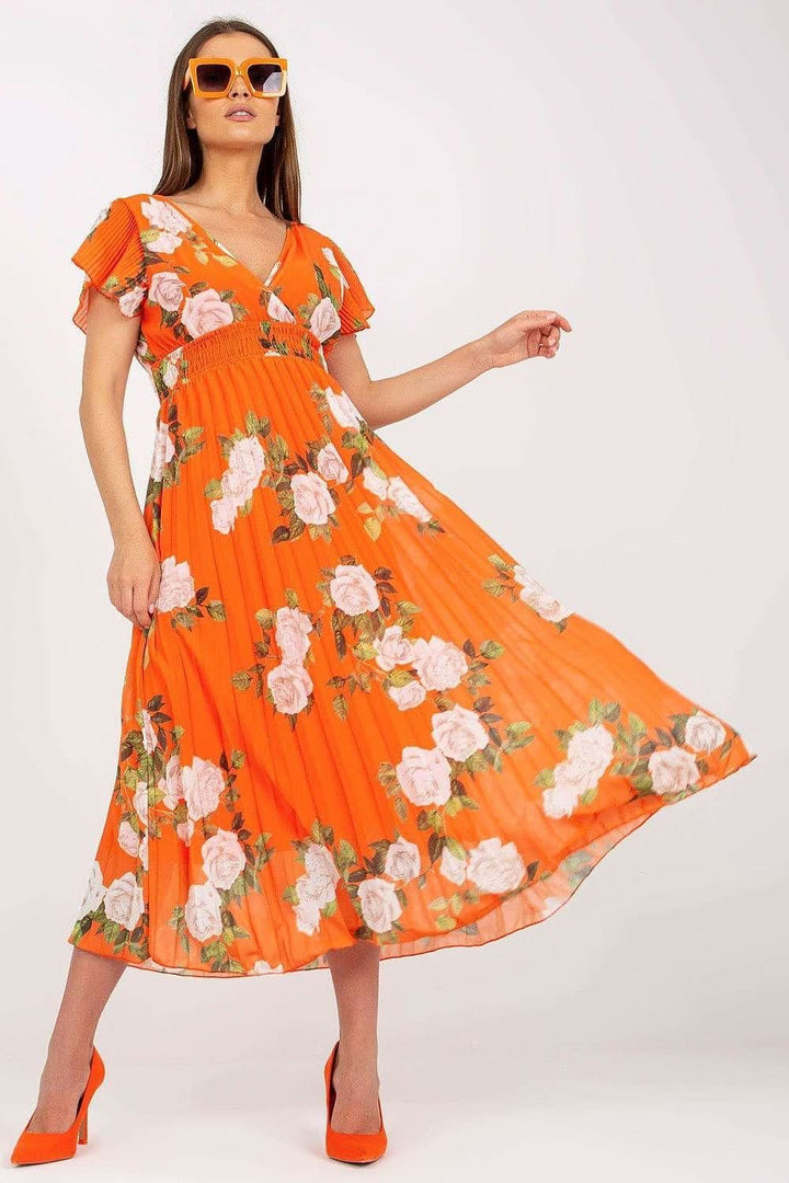 Vibrant orange dress featuring a rose print, frilled short sleeves, envelope neckline, pleated flared bottom, and a lining for added comfort and style.