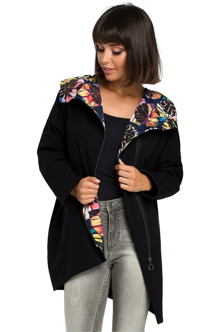 A trendy oversized sweatshirt featuring a fabric insert with a print in the hood, side seam pockets, and made from soft, high-quality knit for a sporty look and comfort. Each piece may feature unique pattern placement due to the design.






