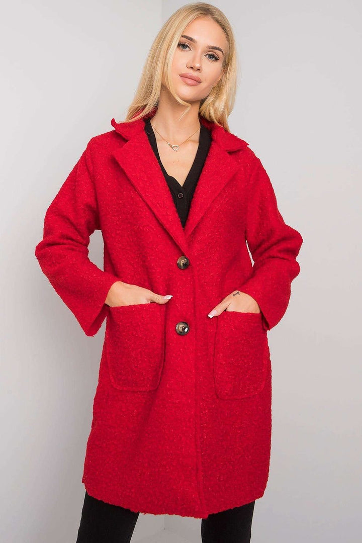 A vibrant red bouclé coat designed for autumn, featuring a textured finish, button closure, and convenient slip pockets. Stylish and cozy, it’s perfect for transitional weather.