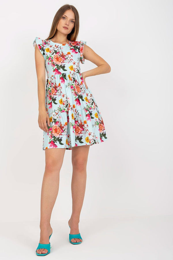 Light and airy summer dress with frilled short sleeves, made from floral fabric, featuring a flared bottom with an additional frill for a playful and feminine look.