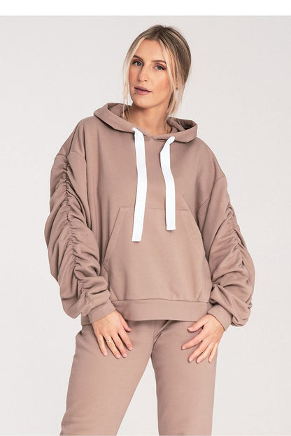 A thick cotton hoodie with ribbing, featuring a large front pocket and long, wide, decorative pleated sleeves. A stylish and comfortable choice for casual wear.






