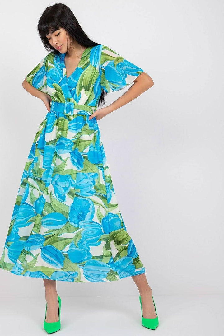 This dress embodies the perfect balance of everyday elegance, offering both comfort and style. The vibrant print adds a fun and energetic touch, making it suitable for any occasion. Its flared cut is flattering and feminine, ideal for both social gatherings and work. Crafted from easy-care polyester, it maintains its pristine look with minimal effort. The midi length offers versatility, while the short sleeves and heart neckline with an envelope cut enhance the dress's subtle feminine charm.