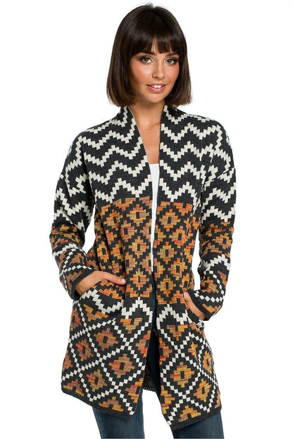 Cozy unbuttoned cardigan featuring a vibrant Aztec pattern, designed to keep you warm on cold days. With convenient pockets in the side seams, this cardigan adds a unique, stylish touch to your wardrobe.