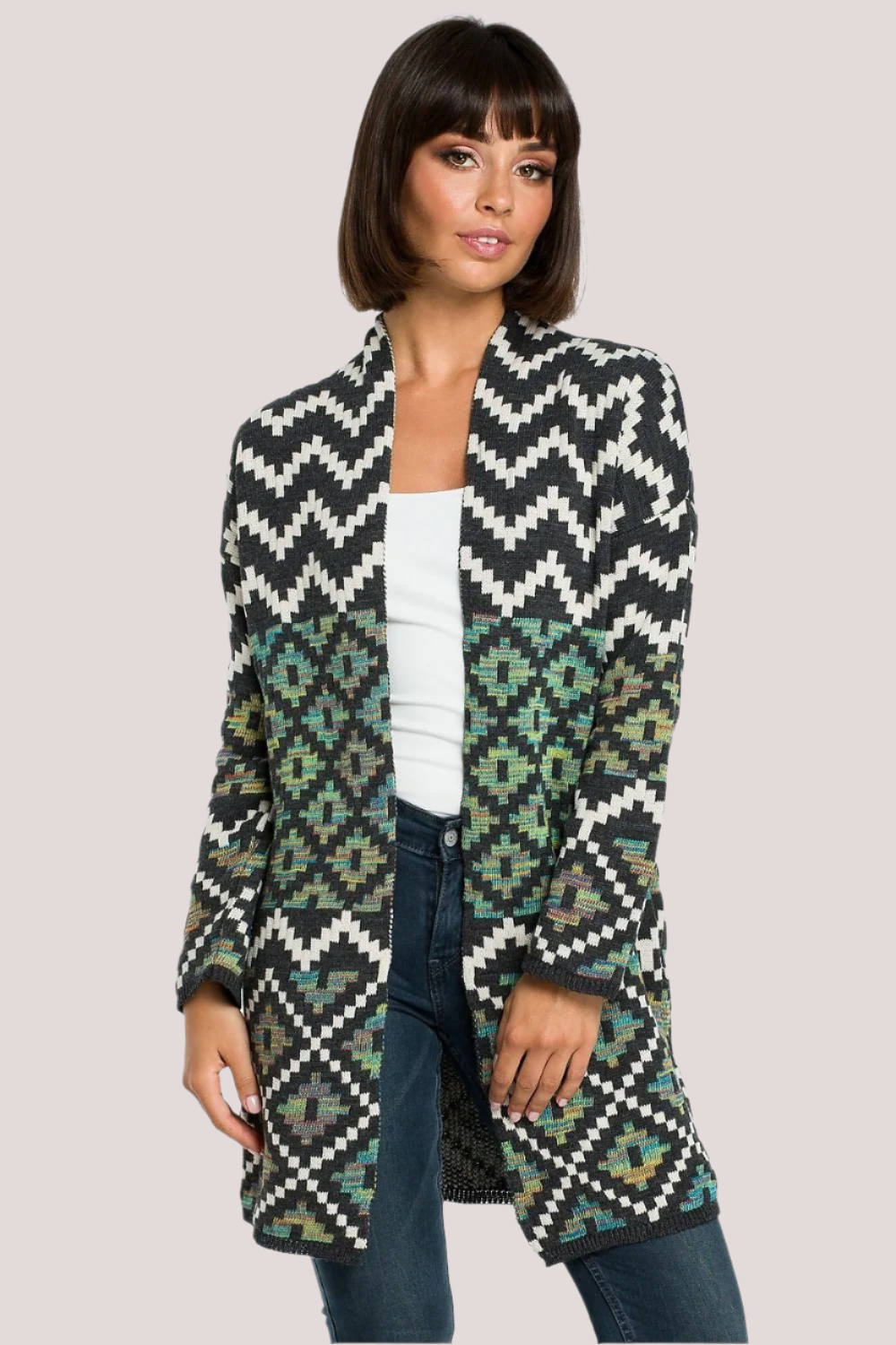 Cozy unbuttoned cardigan featuring a vibrant Aztec pattern, designed to keep you warm on cold days. With convenient pockets in the side seams, this cardigan adds a unique, stylish touch to your wardrobe.