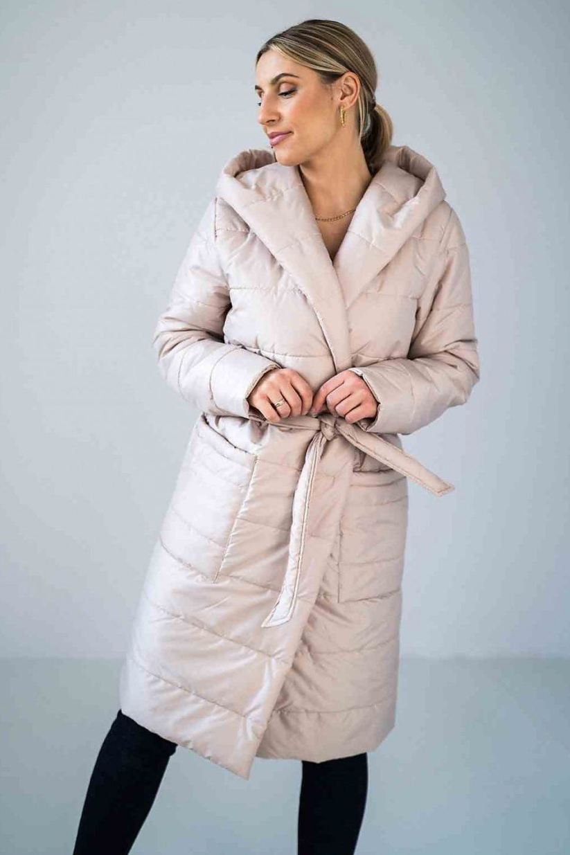 Quilted knee-length coat with hood, waist tie, straight sleeves, and patch slip pockets, lined for extra warmth and comfort.






