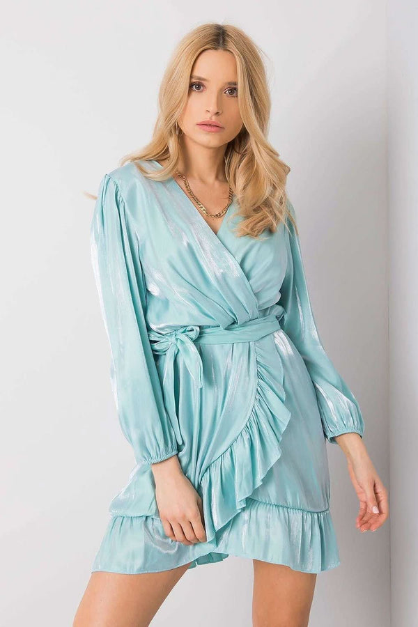 This elegant  dress is perfect for evening wear, offering a sophisticated and flattering silhouette. The long sleeves provide coverage, while the tie belt at the waist accentuates your shape. A delicate frill at the hem adds a feminine and playful touch to the design, making this dress a versatile and chic option for evening occasions. The combination of sleek lines and subtle details creates a timeless and elegant look.







