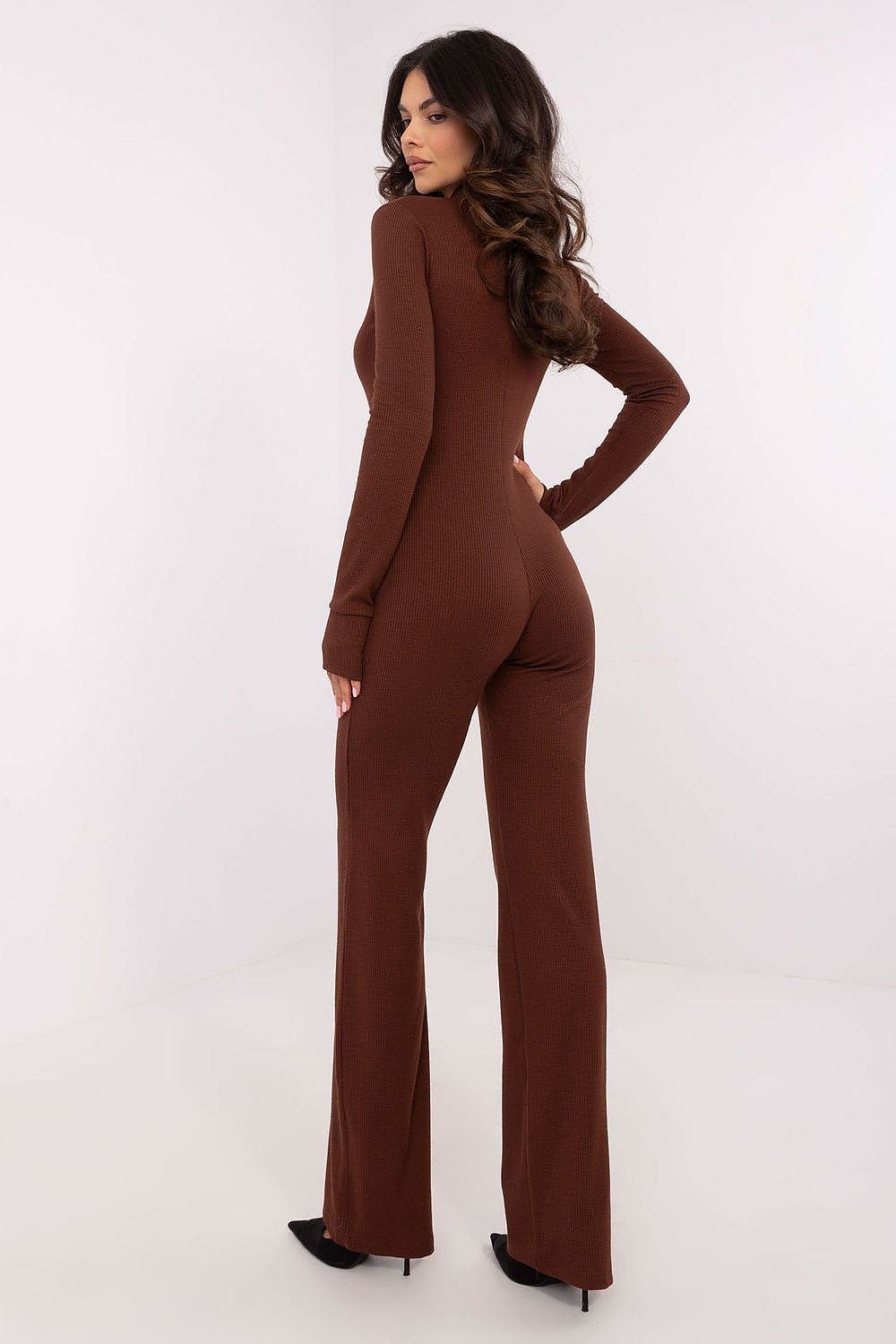 Comfortable women's jumpsuit made from a stretchy cotton blend with ribbed fabric, featuring a stand-up collar, thumb hole cuffs, and a functional zipper closure for a stylish, modern look.