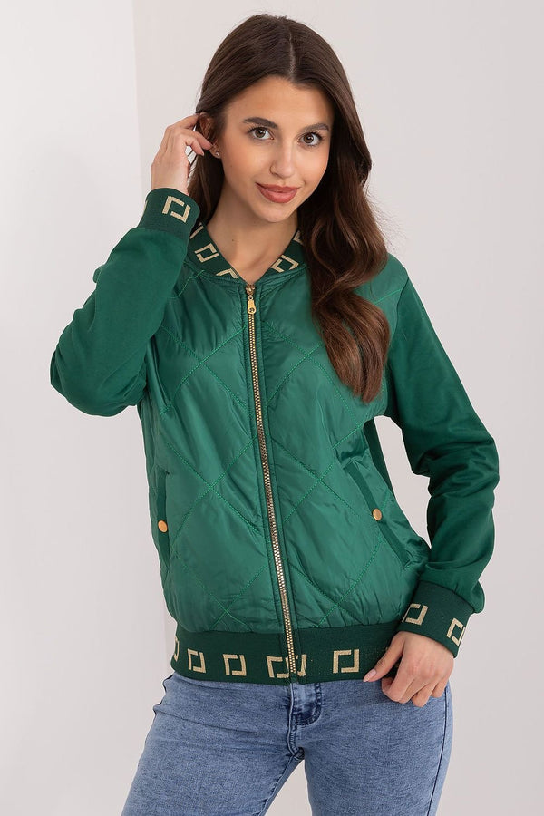 A stylish green quilted bomber jacket for women, featuring gold zipper and button accents, and decorative gold geometric patterns on the cuffs and waistband.






