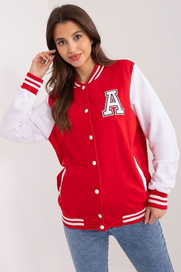 Comfortable women's sports sweatshirt featuring ribbed contrasting stripes, a stand-up collar, and snap button closure. Made from predominantly cotton material, it includes decorative patches, slip pockets, and long white sleeves for a sporty yet stylish look. Perfect for everyday wear and physical activity.