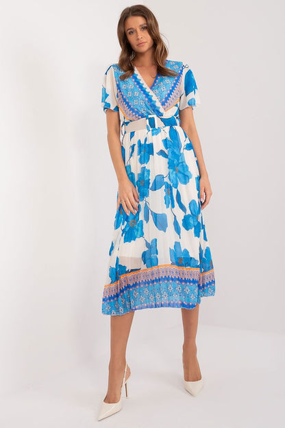 Blue Summer dress with short sleeves in the form of frills. Dress with lining. Envelope neckline, belt fastened at the waist, pleated bottom. An ideal choice for many occasions.