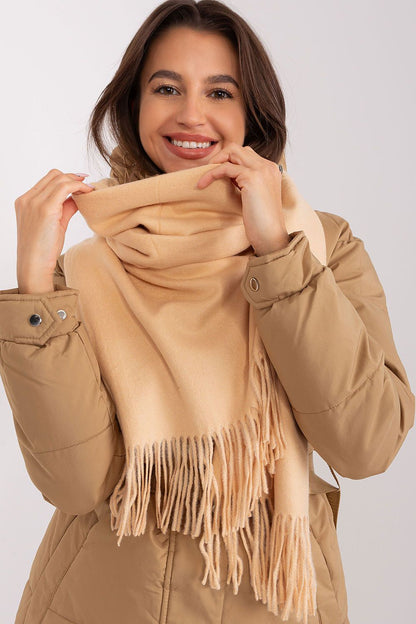 A cozy long scarf featuring decorative tassels, perfect for adding warmth and style to your winter wardrobe. Ideal for keeping you comfortable during colder months.






