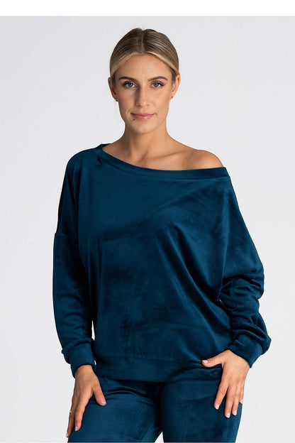 An oversized blouse featuring a boat neckline that can be worn off one or both shoulders. Finished with delicate cuffs for a stylish and elegant touch. Perfect for versatile, relaxed styling.






