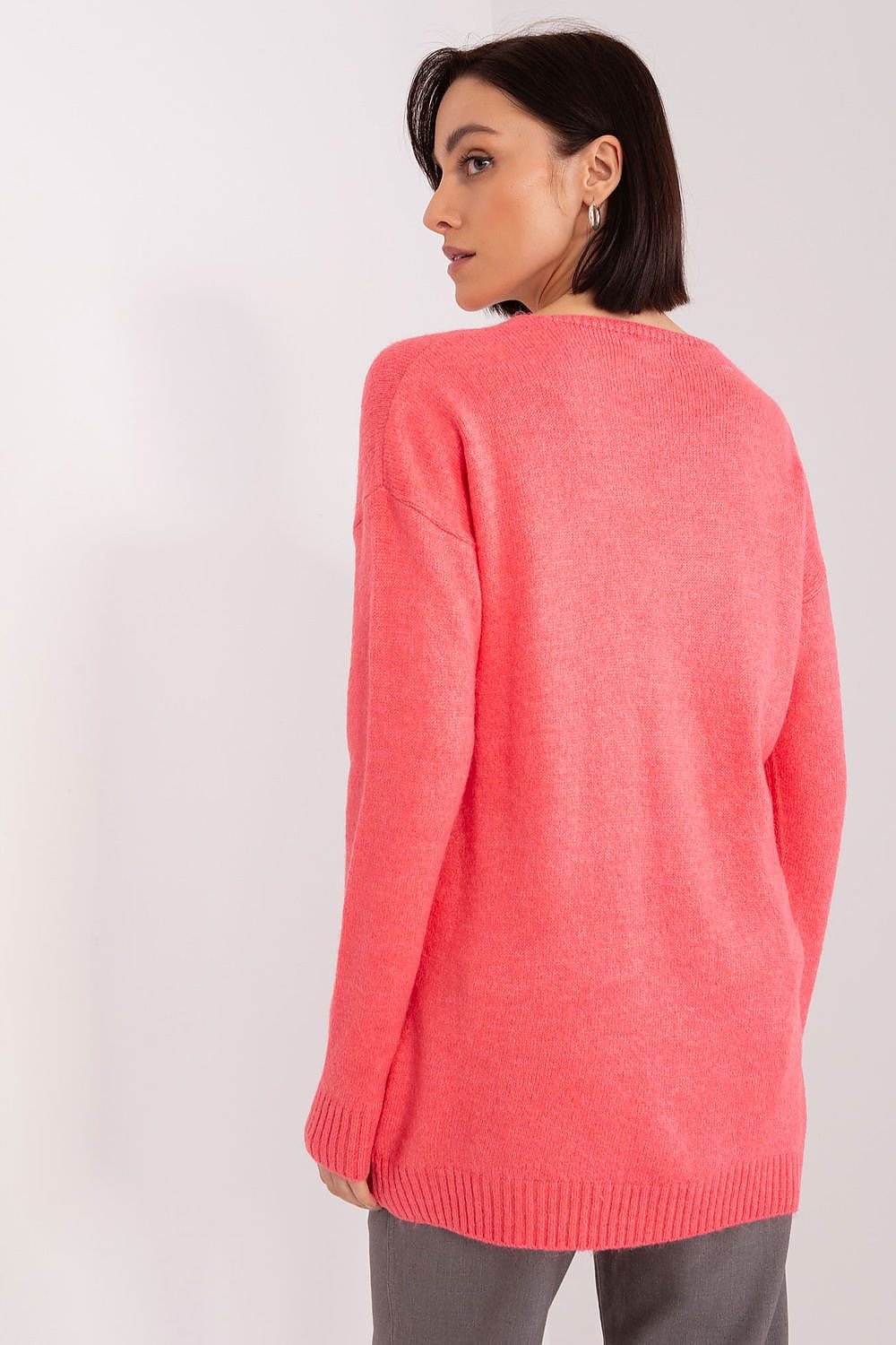 A soft pink sweater with long sleeves and a heart-shaped neckline, perfect for casual or semi-formal occasions. Made from comfortable, easy-care acrylic fabric, ideal for colder days.






