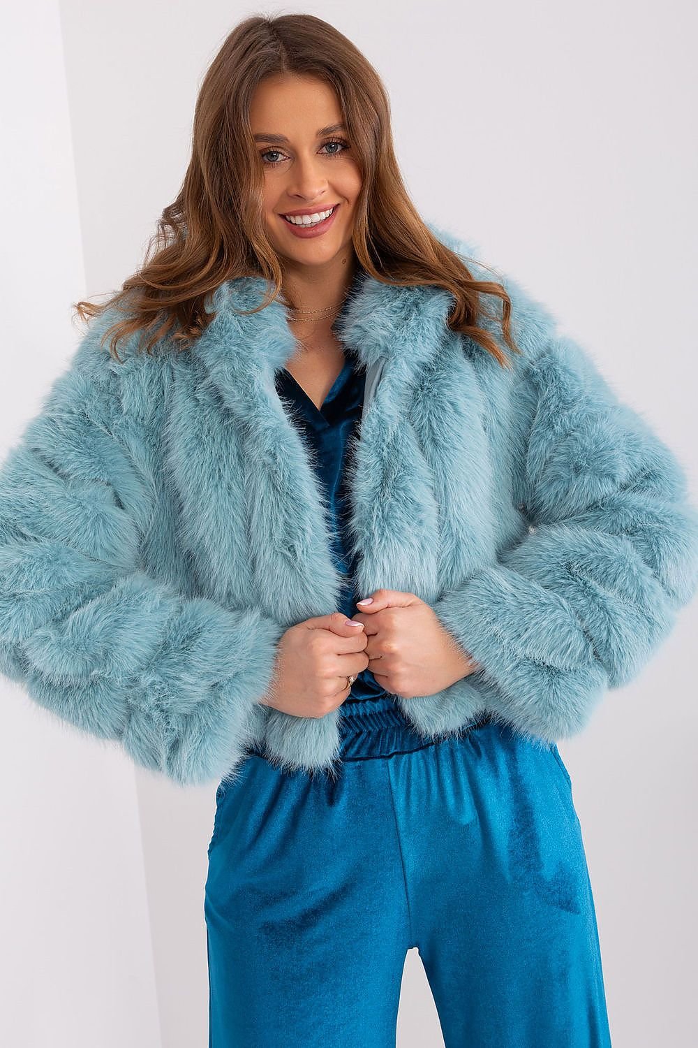 A versatile women's transitional jacket with a unique fur design, perfect for both everyday wear and formal outings. Made from durable polyester, it features a lightweight, weather-resistant construction ideal for fall and winter. The short length, hood, hook-and-loop closure, and lined interior ensure comfort, warmth, and style for colder days