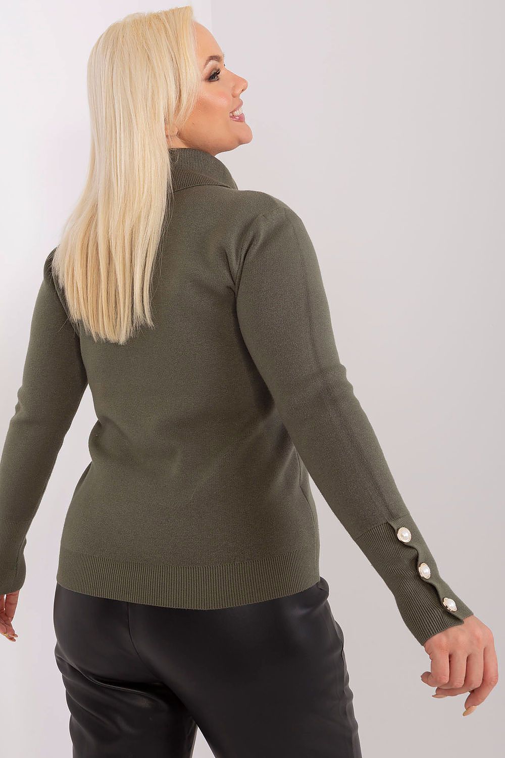 A turtleneck sweater made of lightweight viscose with decorative button details on the sleeve cuffs for a chic, everyday look.

