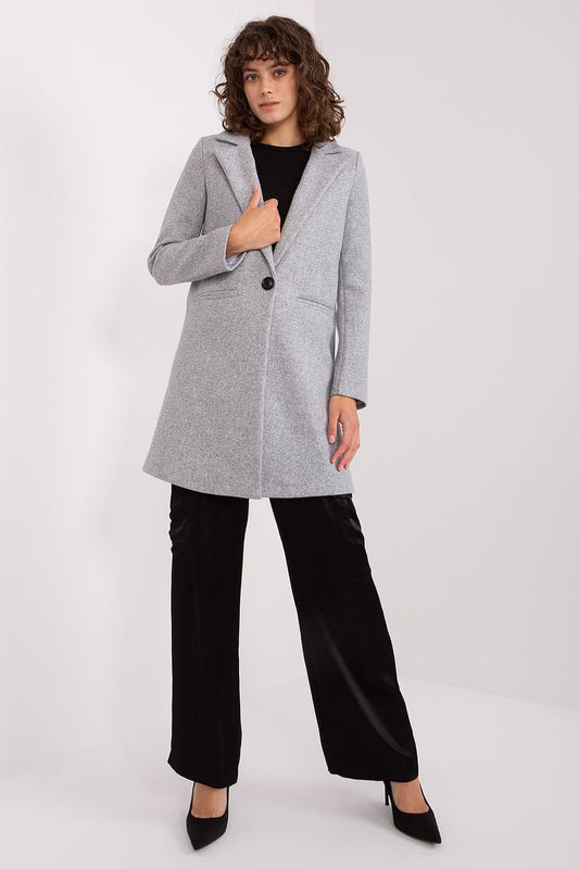 Classic women's polyester coat with button closure, long sleeves, and lining, ideal for both casual and formal wear in autumn and winter.






