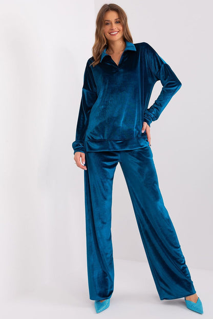 A women's velour set made from fine cotton, featuring a long-sleeve blouse with an elegant collar neckline. Paired with high-waisted, wide-leg pants with practical side slip pockets for comfort and style. Perfect for everyday wear, work, or relaxation.






