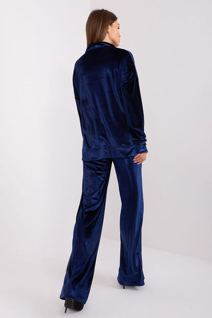 A women's velour set made from fine cotton, featuring a long-sleeve blouse with an elegant collar neckline. Paired with high-waisted, wide-leg pants with practical side slip pockets for comfort and style. Perfect for everyday wear, work, or relaxation.






