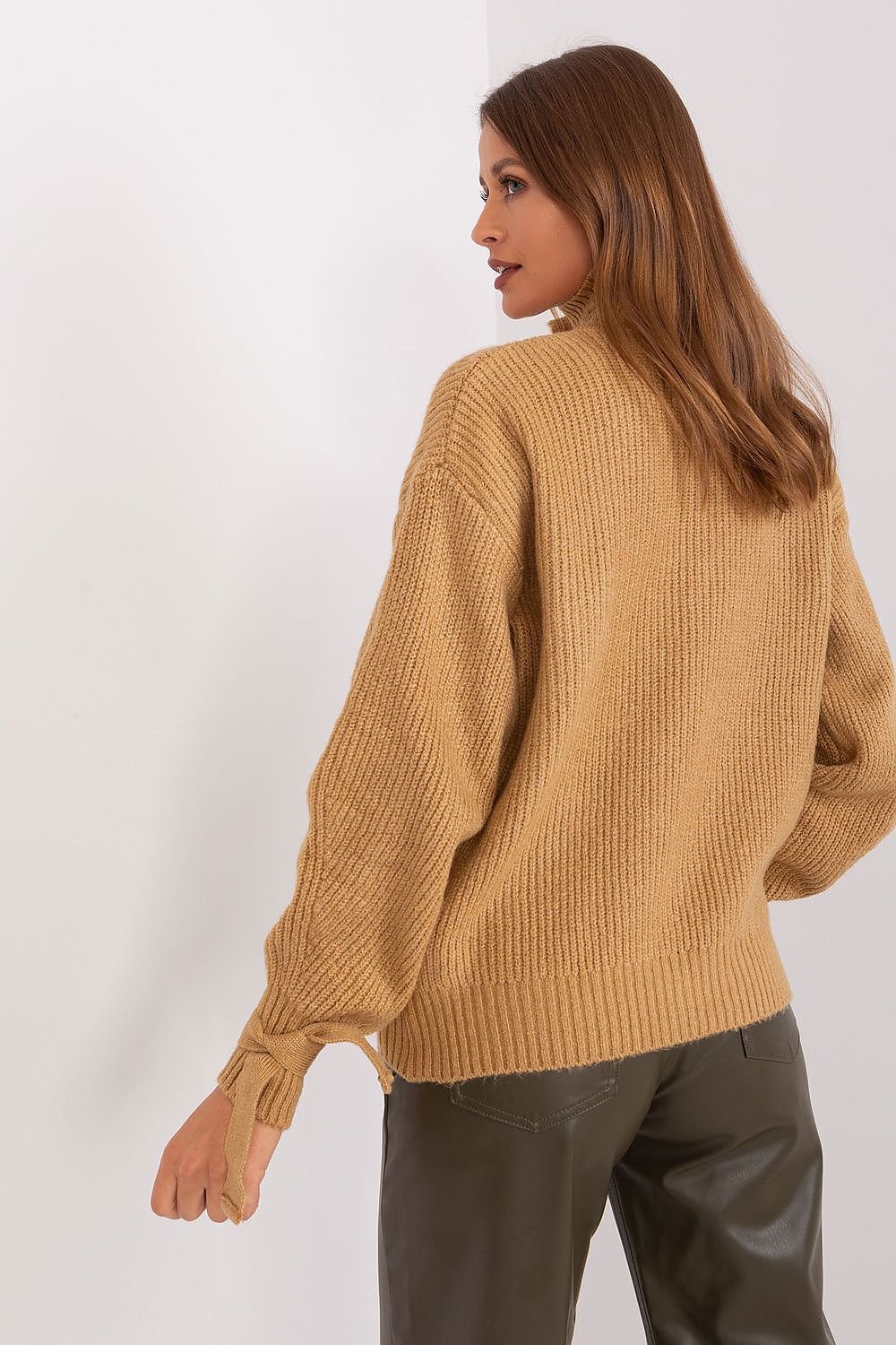 This unique brown sweater seamlessly blends comfort and style, making it a standout addition to your collection. Its versatile design is perfect for both casual and semi-formal occasions.

