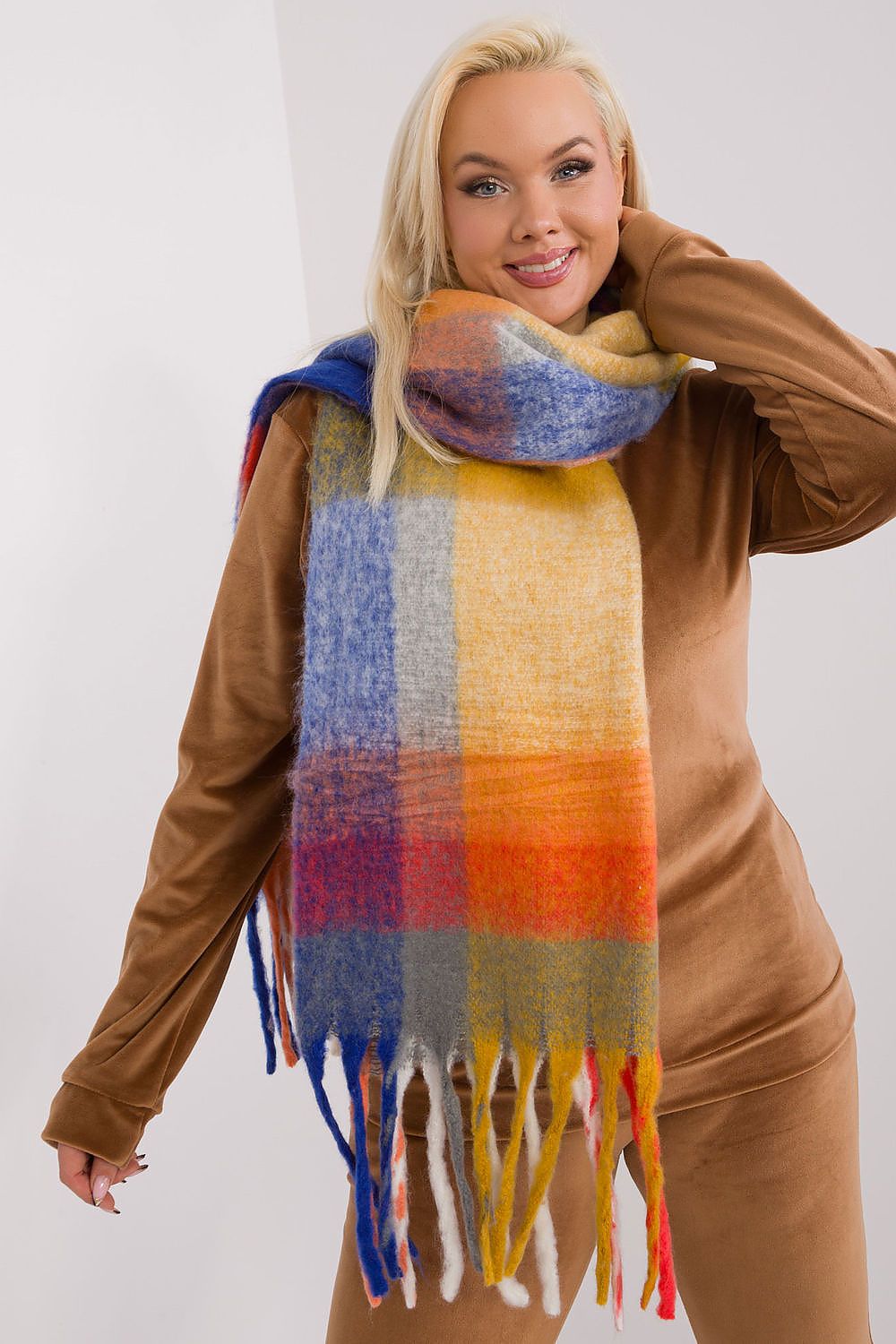 A long, colorful plaid scarf made of durable polyester, featuring subtle tassels for added lightness and style. Perfect for fall and winter, this versatile scarf offers various ways to wear it, adding warmth and character to your wardrobe.






