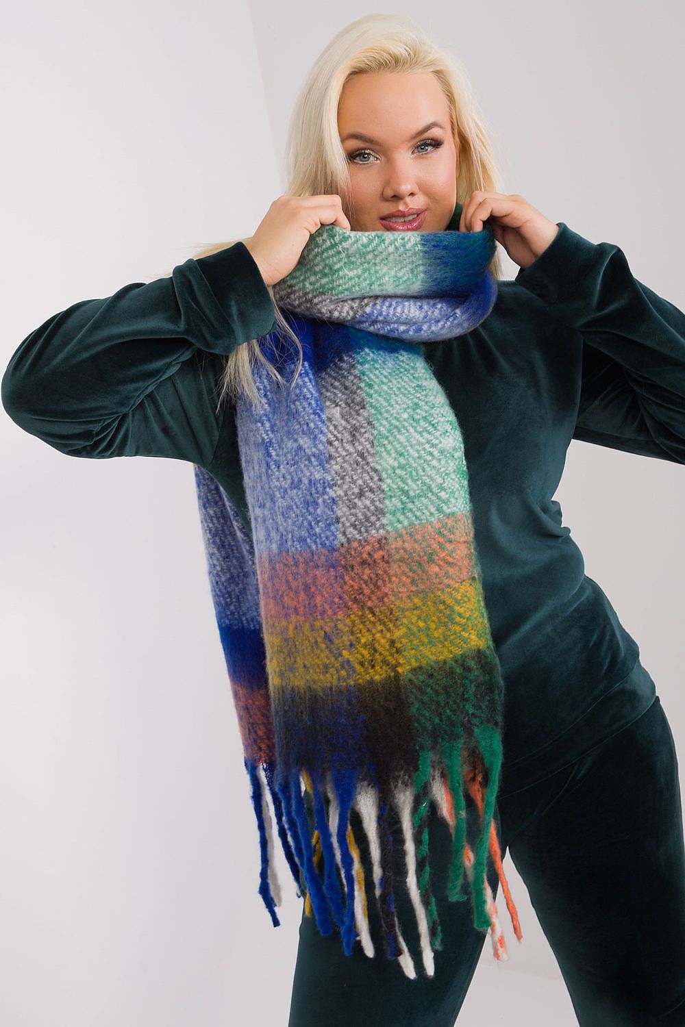 A long, colorful plaid scarf made of durable polyester, featuring subtle tassels for added lightness and style. Perfect for fall and winter, this versatile scarf offers various ways to wear it, adding warmth and character to your wardrobe.






