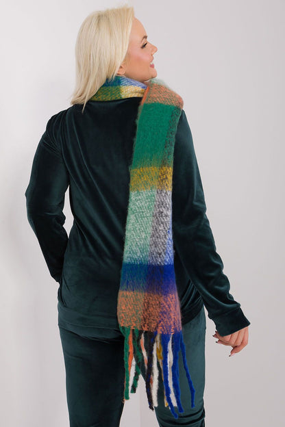 A long, colorful plaid scarf made of durable polyester, featuring subtle tassels for added lightness and style. Perfect for fall and winter, this versatile scarf offers various ways to wear it, adding warmth and character to your wardrobe.






