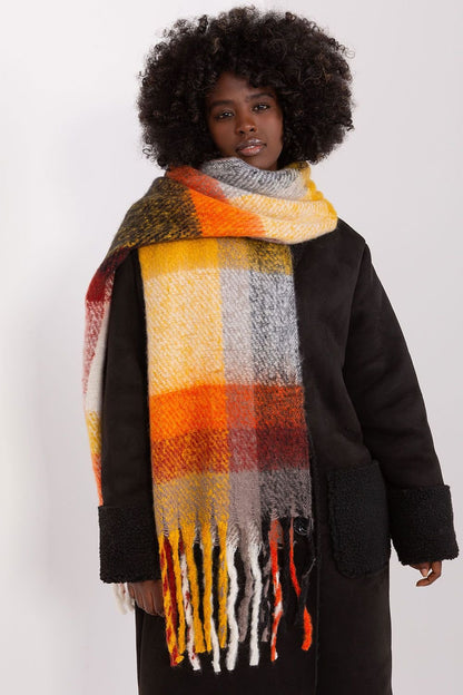 A long, colorful plaid scarf made of durable polyester, featuring subtle tassels for added lightness and style. Perfect for fall and winter, this versatile scarf offers various ways to wear it, adding warmth and character to your wardrobe.






