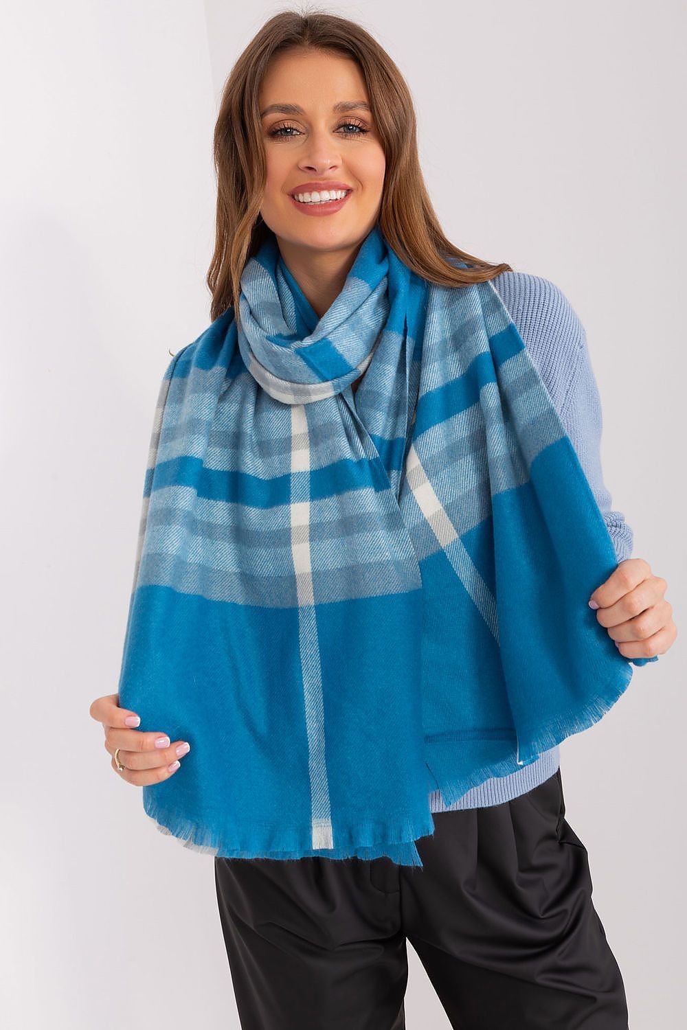 A stylish long scarf with a colorful checkered pattern, made of durable polyester for practicality and warmth. Perfect for fall and winter, it offers versatile styling options to enhance your outfits while keeping you cozy.






