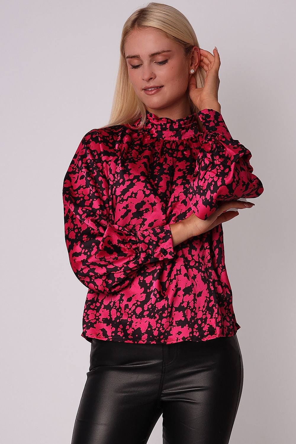 Elegant cherry-black blouse with a pleated collar, long sleeves, and buttoned cuffs, perfect for pairing with black jeans or leather leggings for an evening look.
