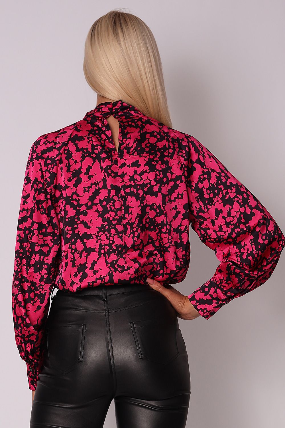 Elegant cherry-black blouse with a pleated collar, long sleeves, and buttoned cuffs, perfect for pairing with black jeans or leather leggings for an evening look.
