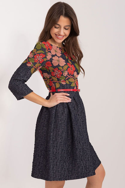 An elegant flared dress with floral embroidery, designed for various occasions. Featuring a pre-knee length, 3/4 sleeves, and a buckled belt, it accentuates the waist and exudes feminine charm. Made from cotton, the dress offers both comfort and class, with a covered zipper for easy wear. Perfect for work or special events, this dress combines elegance, comfort, and style.






