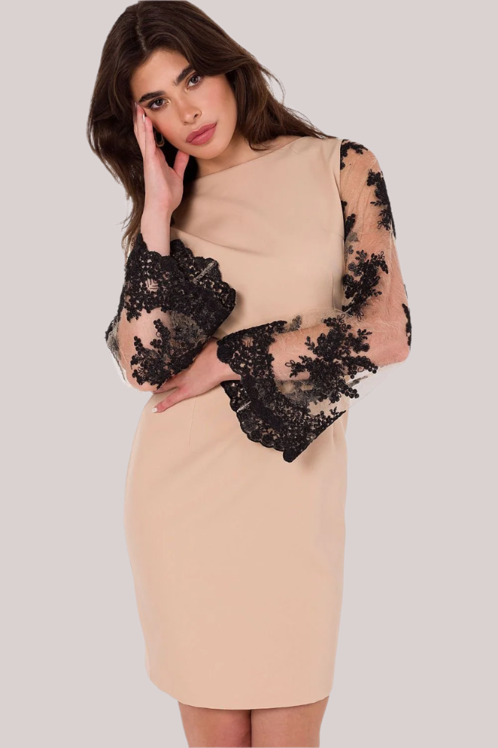 A sophisticated dress featuring intricate guipure sleeves, a round neckline, and a mid-thigh length, with a covered back zipper, offering a timeless and refined look for both formal and evening occasions.






