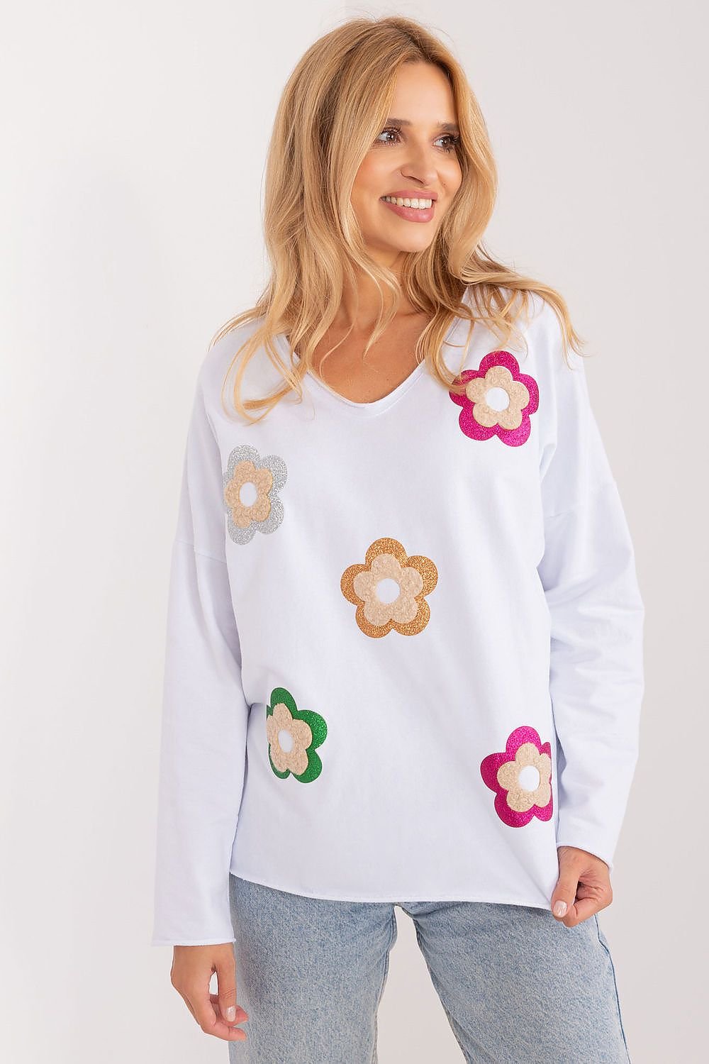 Charming floral blouse made from high-quality cotton, featuring a heart neckline, long sleeves, and a fresh, stylish design perfect for casual occasions.