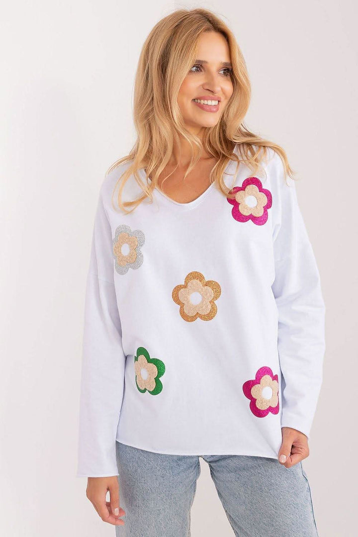 Charming floral blouse made from high-quality cotton, featuring a heart neckline, long sleeves, and a fresh, stylish design perfect for casual occasions.