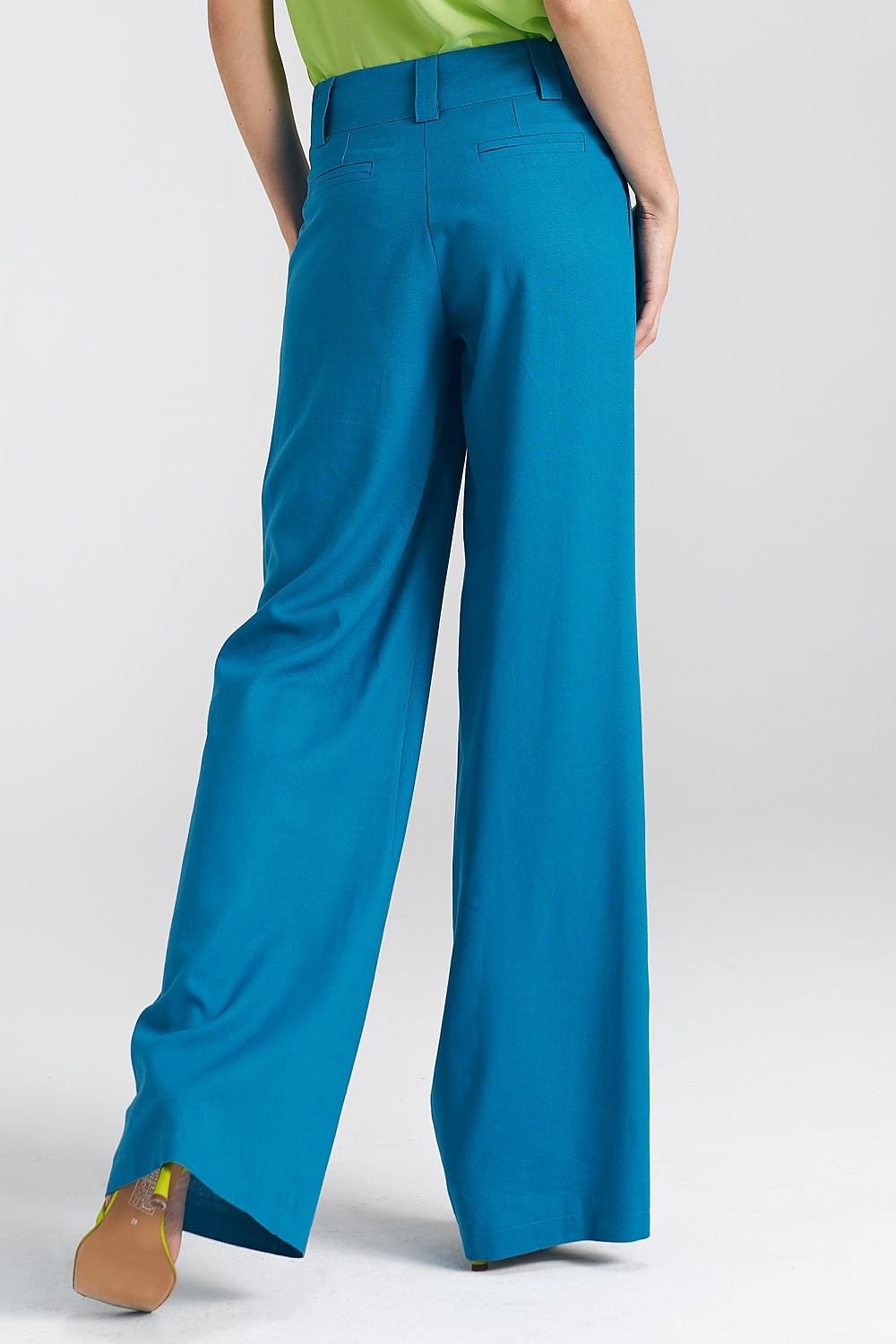 Women's relaxed fit pants made from a soft blend of viscose, linen, and cotton. Featuring wide legs, a mid-rise waist, decorative front tab, wide belt loops, functional front pockets, and imitation back pockets. Versatile and stylish for both casual and formal occasions.

