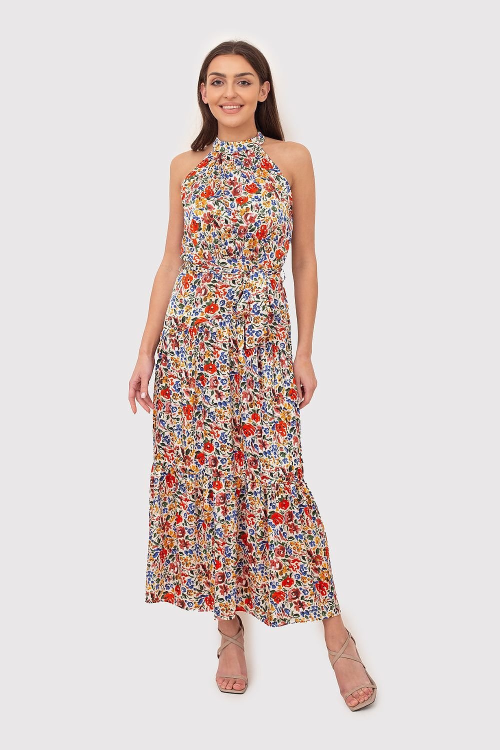 Breezy summer dress made from fabric with vibrant floral print. Featuring a tie waist and a back zipper for a flattering fit, this dress is perfect for warm-weather outings.