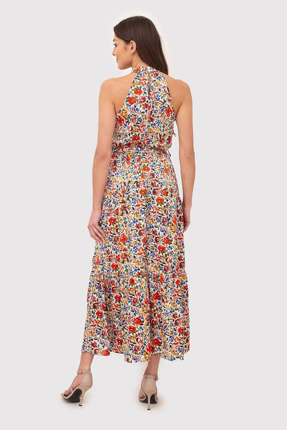 Breezy summer dress made from fabric with vibrant floral print. Featuring a tie waist and a back zipper for a flattering fit, this dress is perfect for warm-weather outings.